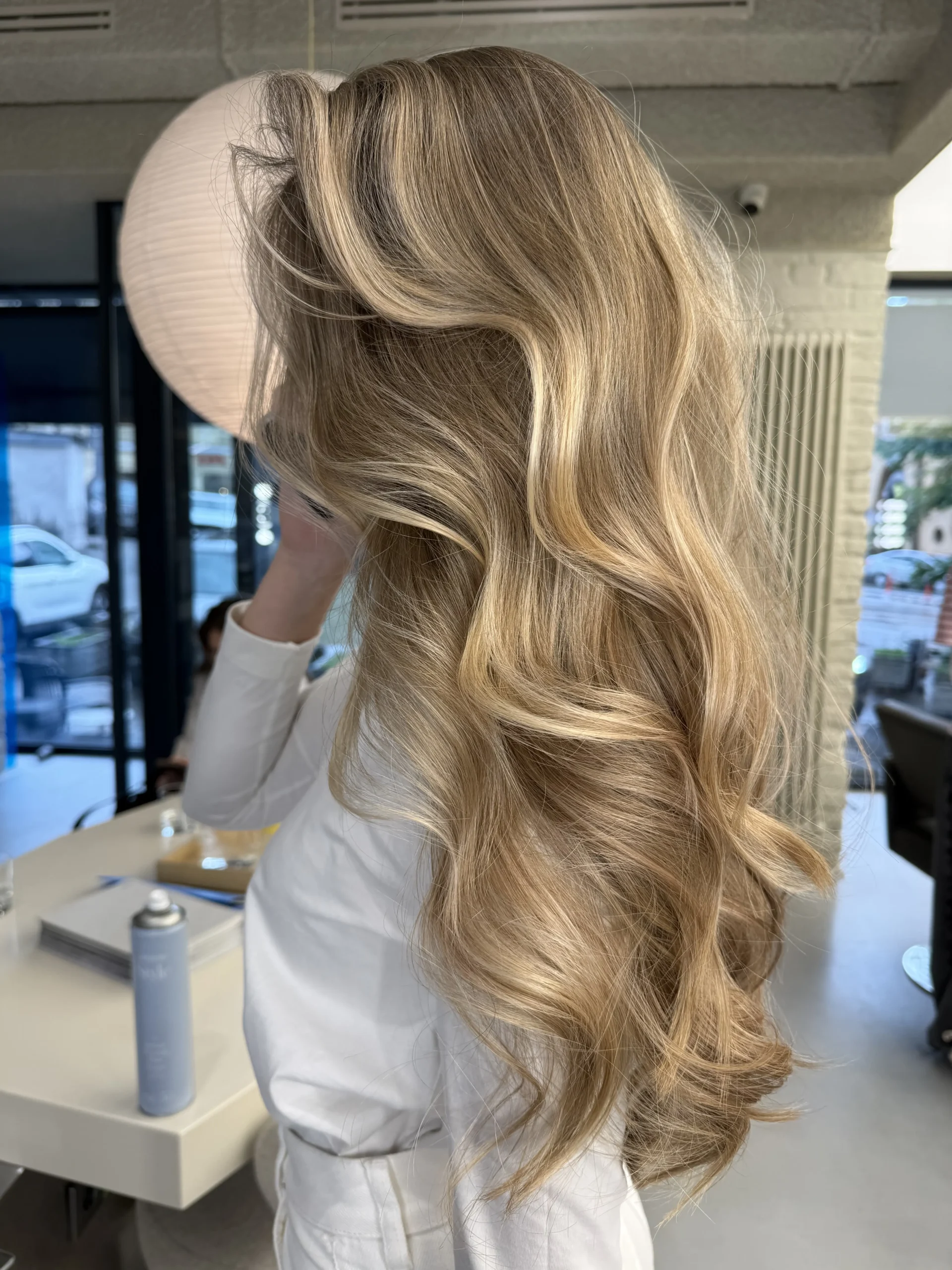 Hair prepared for an event with hairstyling for ladies.
