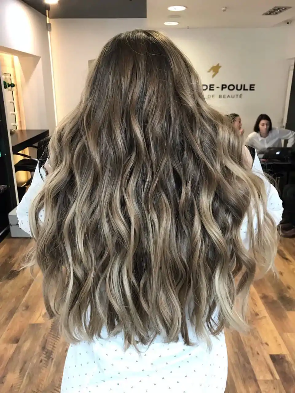 Ombre on long wavy brunette hair with a soft transition to lighter ends