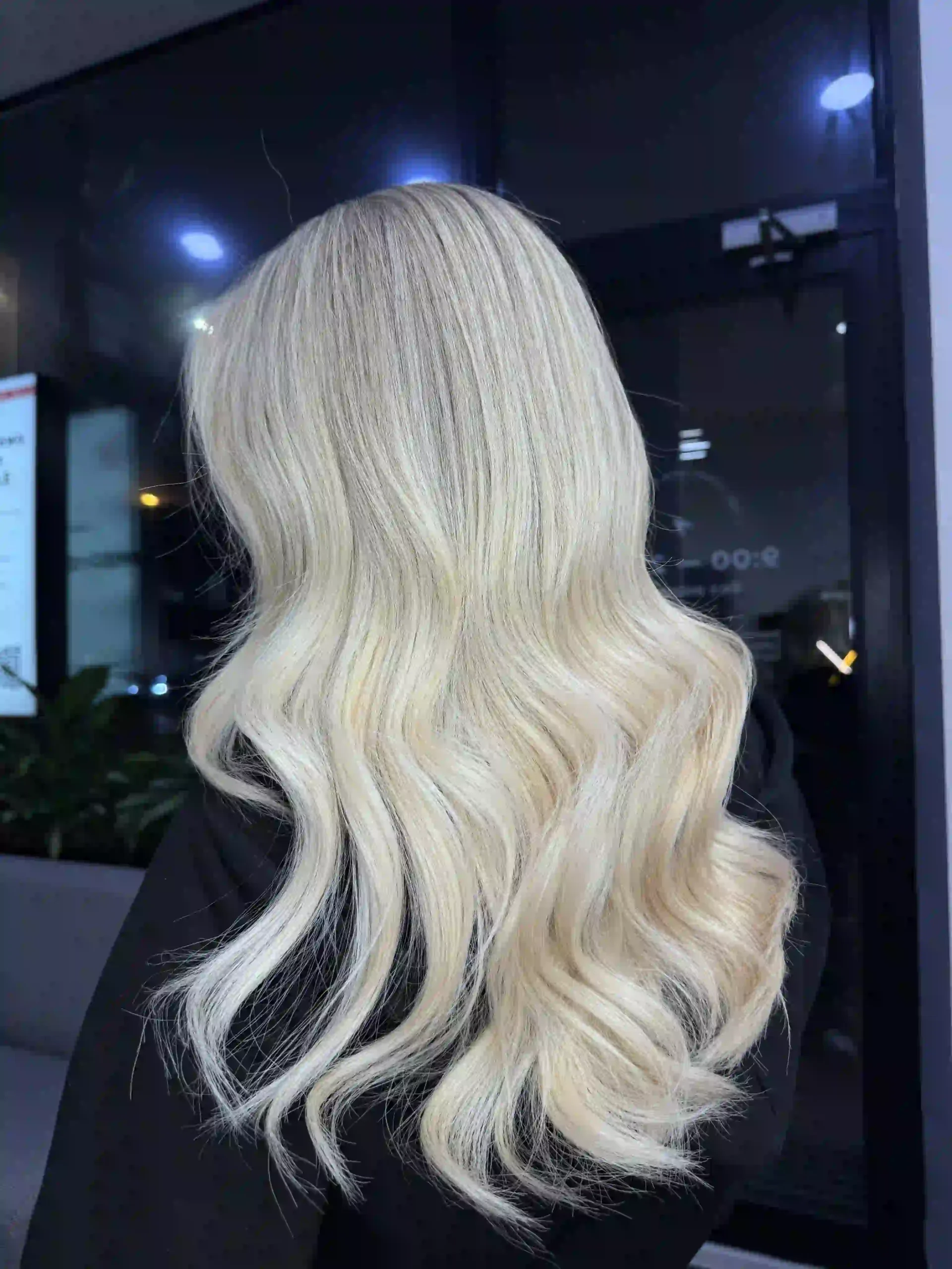 Hair extensions – long platinum blonde hair styled in loose waves