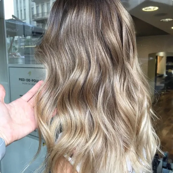 A finished look featuring professional hair highlights.