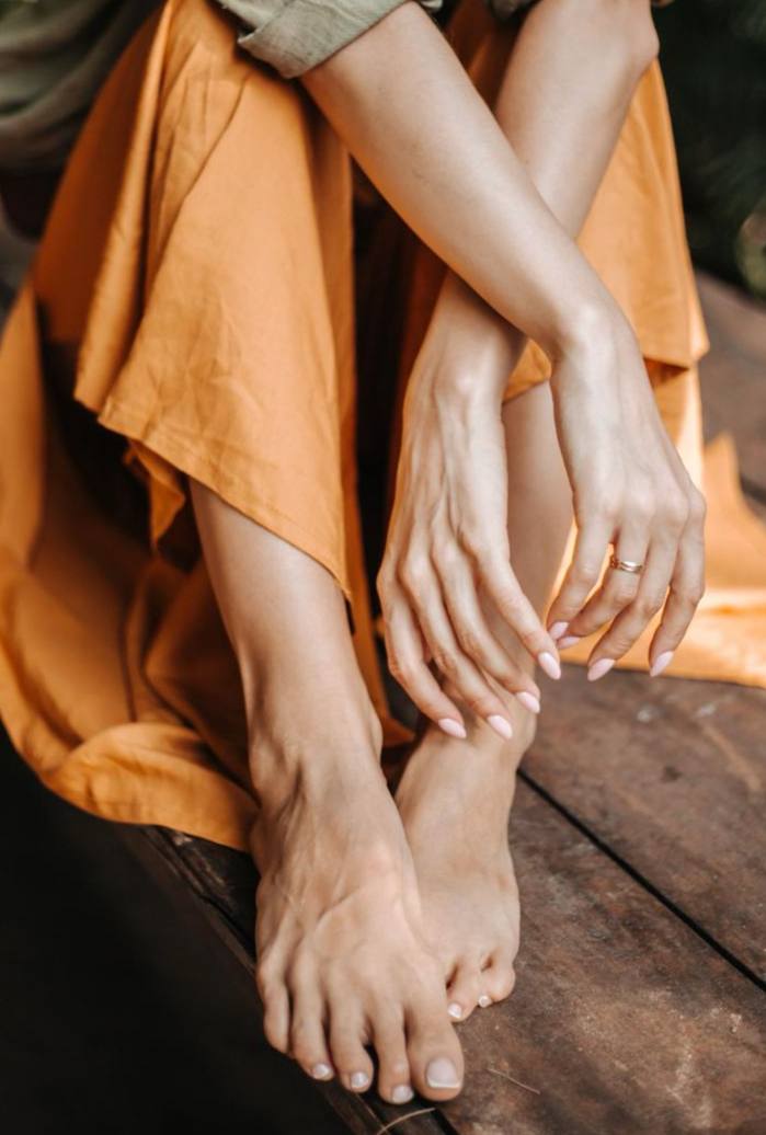 Full pedicure service including exfoliation and nail shaping
