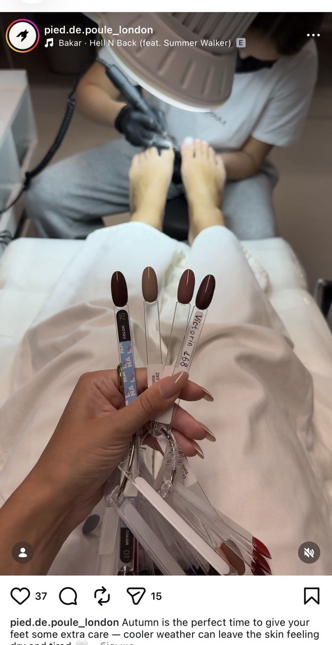 Pedicure technician preparing feet with a soothing foot soak