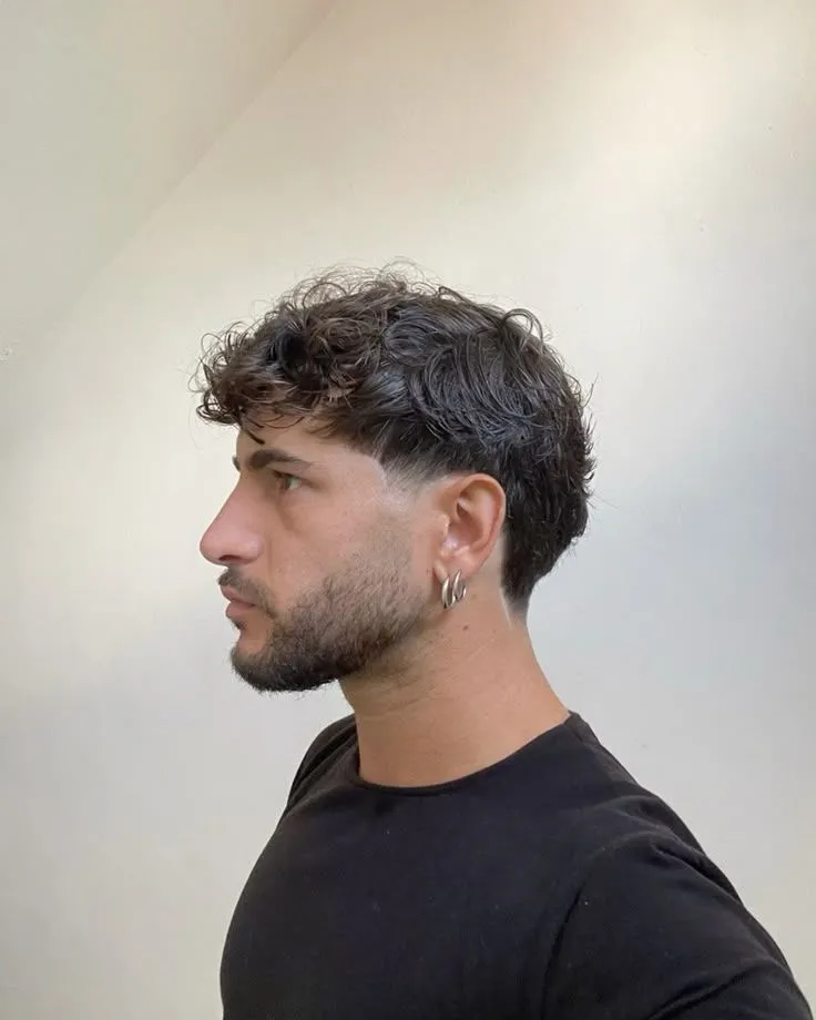 Low Taper Fade with a sharp and well-groomed appearance.