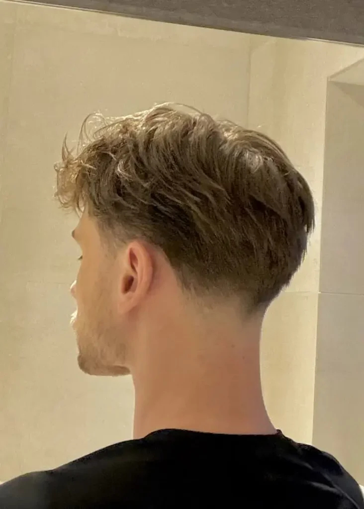 Low Taper Fade with a clean and modern finish.