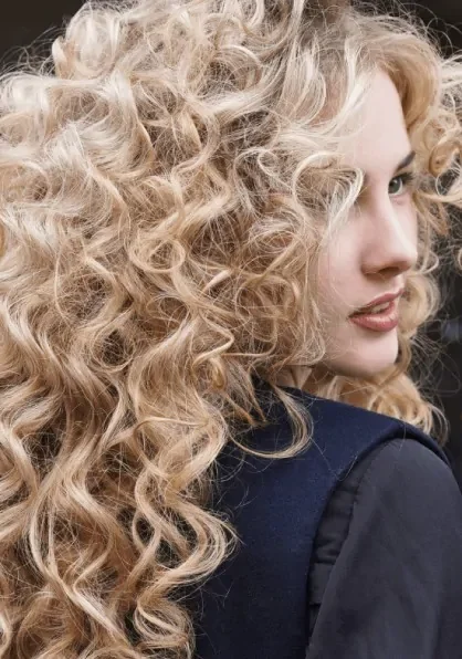 Hair Perm for women with long blonde spiral curls