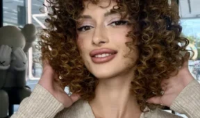 Woman with defined afro curls hairstyle`